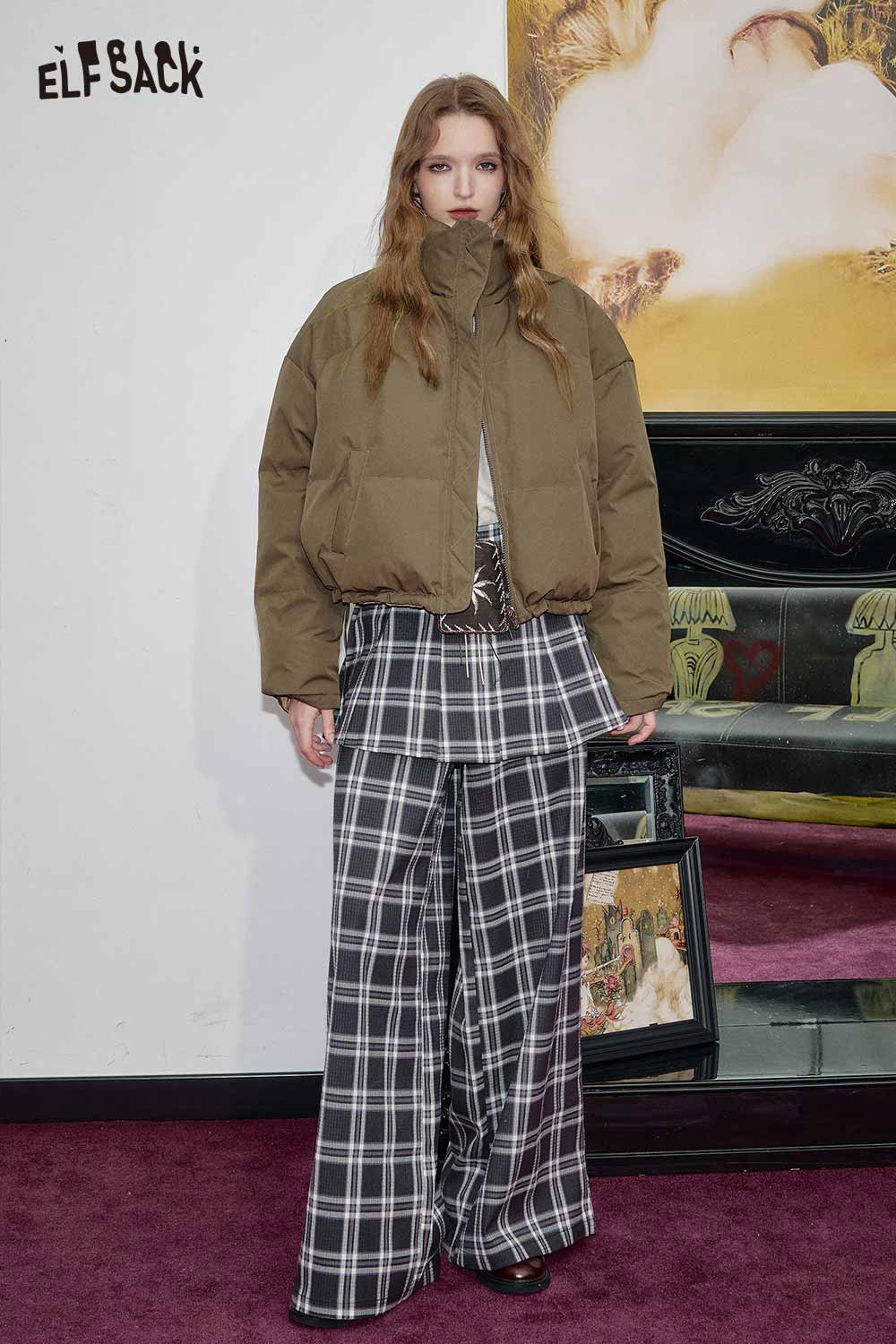 ELFSACK reversible cartoon graphic puffer coat in olive green style over plaid pants
