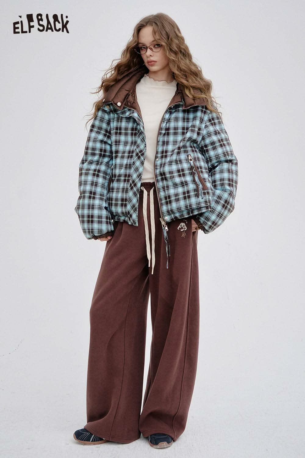 Reversible Y2K down jacket women in plaid design, paired with brown wide-leg pants for a trendy look