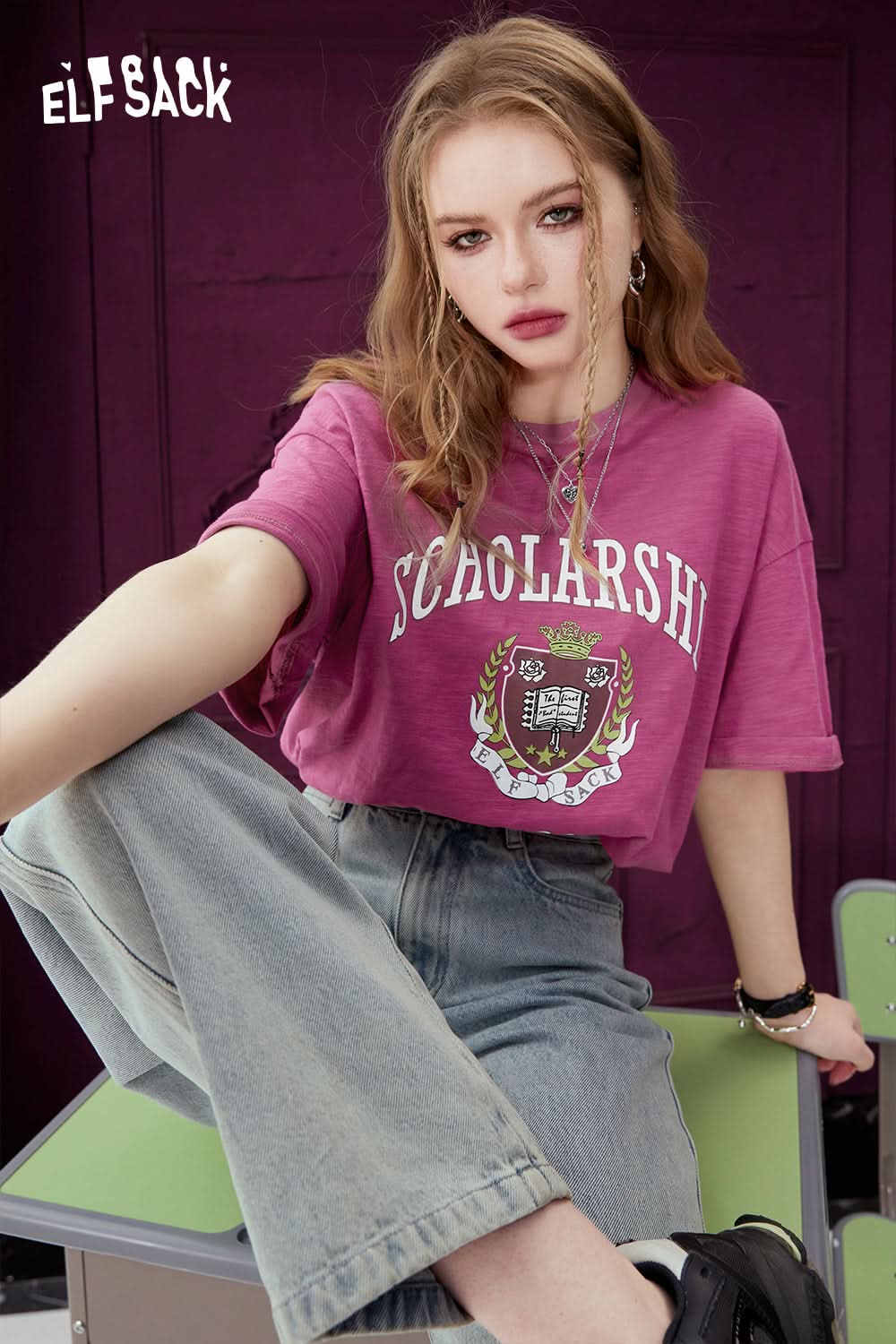 ELFSACK casual purple graphic print t-shirt with scholarship design worn with light blue jeans