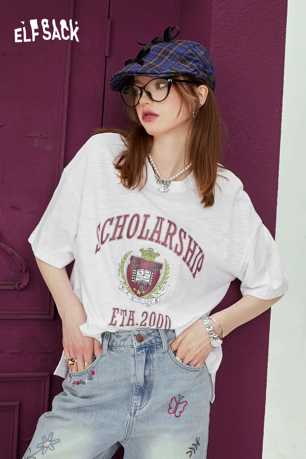 ELFSACK white oversized t-shirt with graphic print scholarship design worn with embroidered jeans