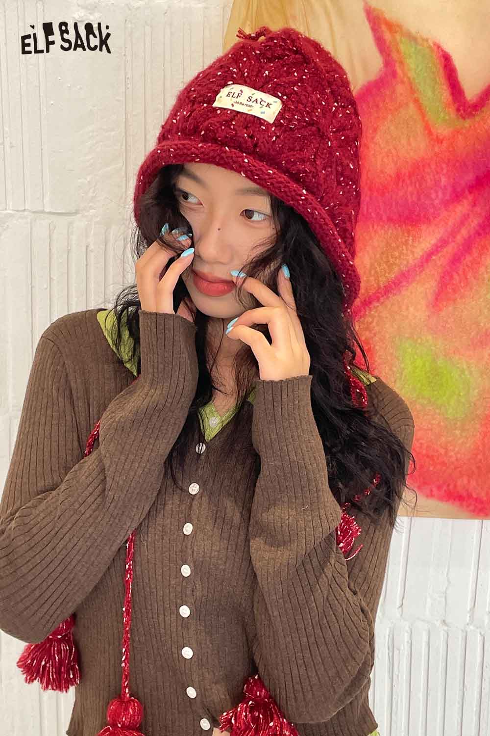 ELFSACK women's braided tassel bucket hat in red, styled with a cozy brown cardigan