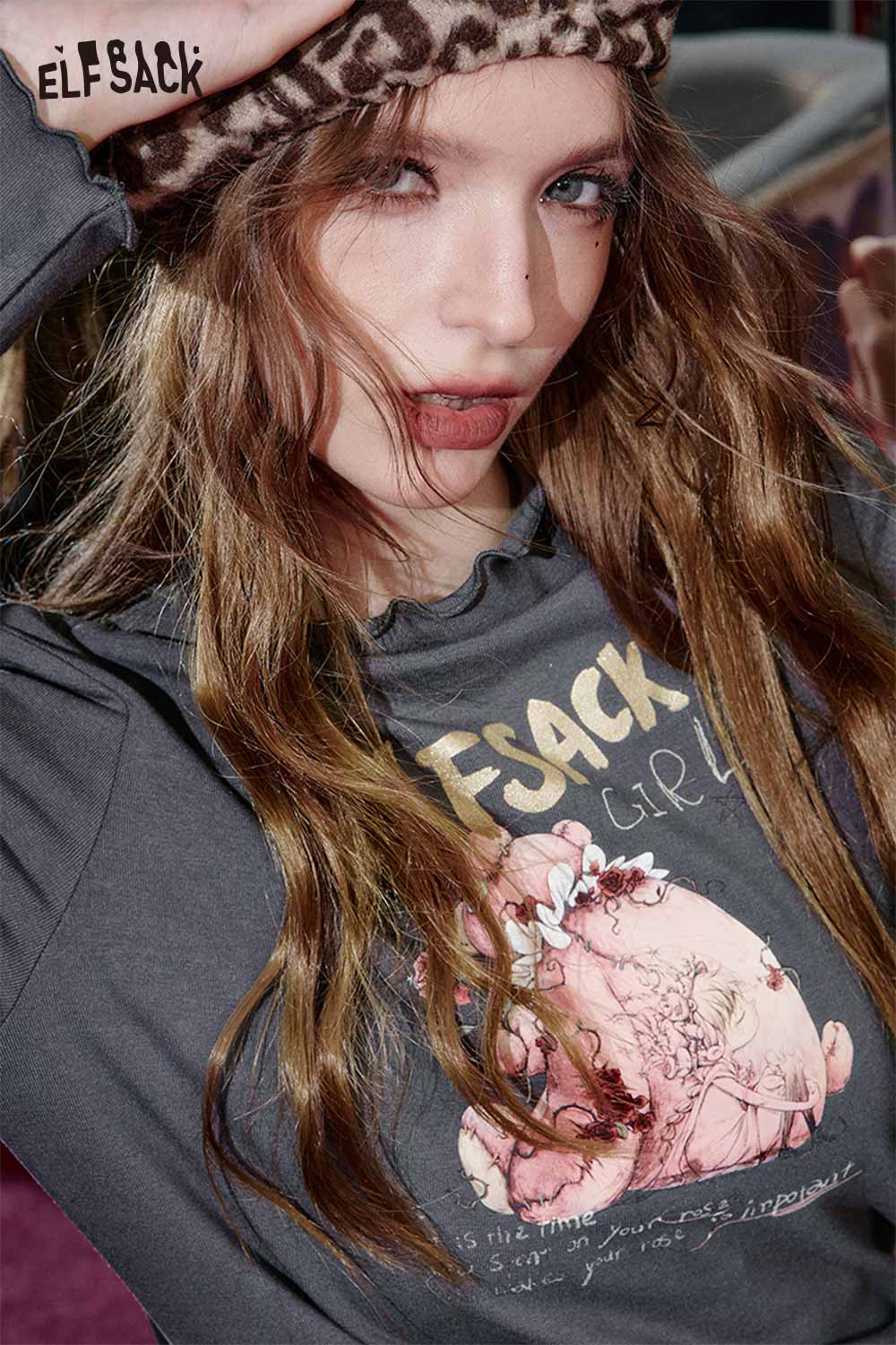 ELFSACK cartoon graphic long sleeve top featuring a playful design and relaxed fit for casual wear