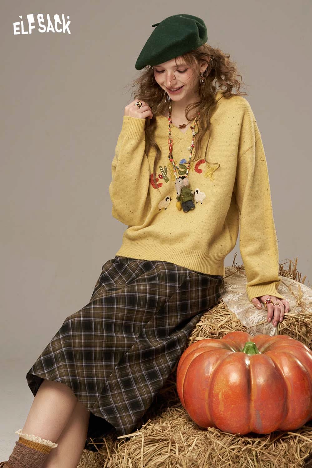 Cute cartoon sheep sweater for women from ELFSACK paired with a plaid skirt and autumn accessories