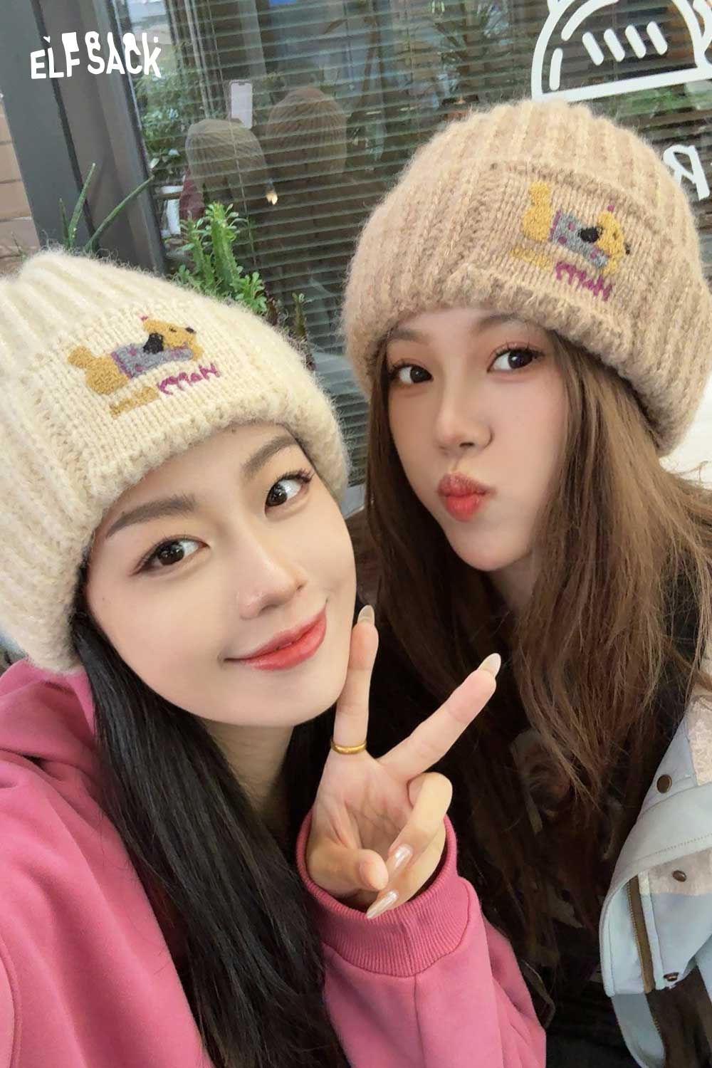 Two friends wearing soft dog embroidered hat in cream and beige, perfect for casual outings