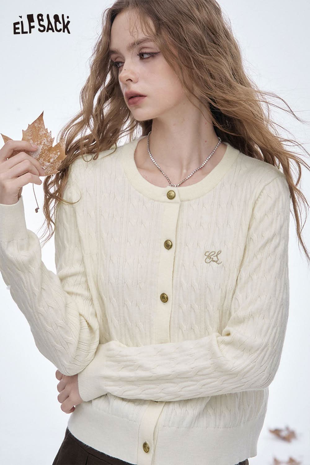 ELFSACK soft embroidered knit sweater in pale yellow with button closure and cable knit design