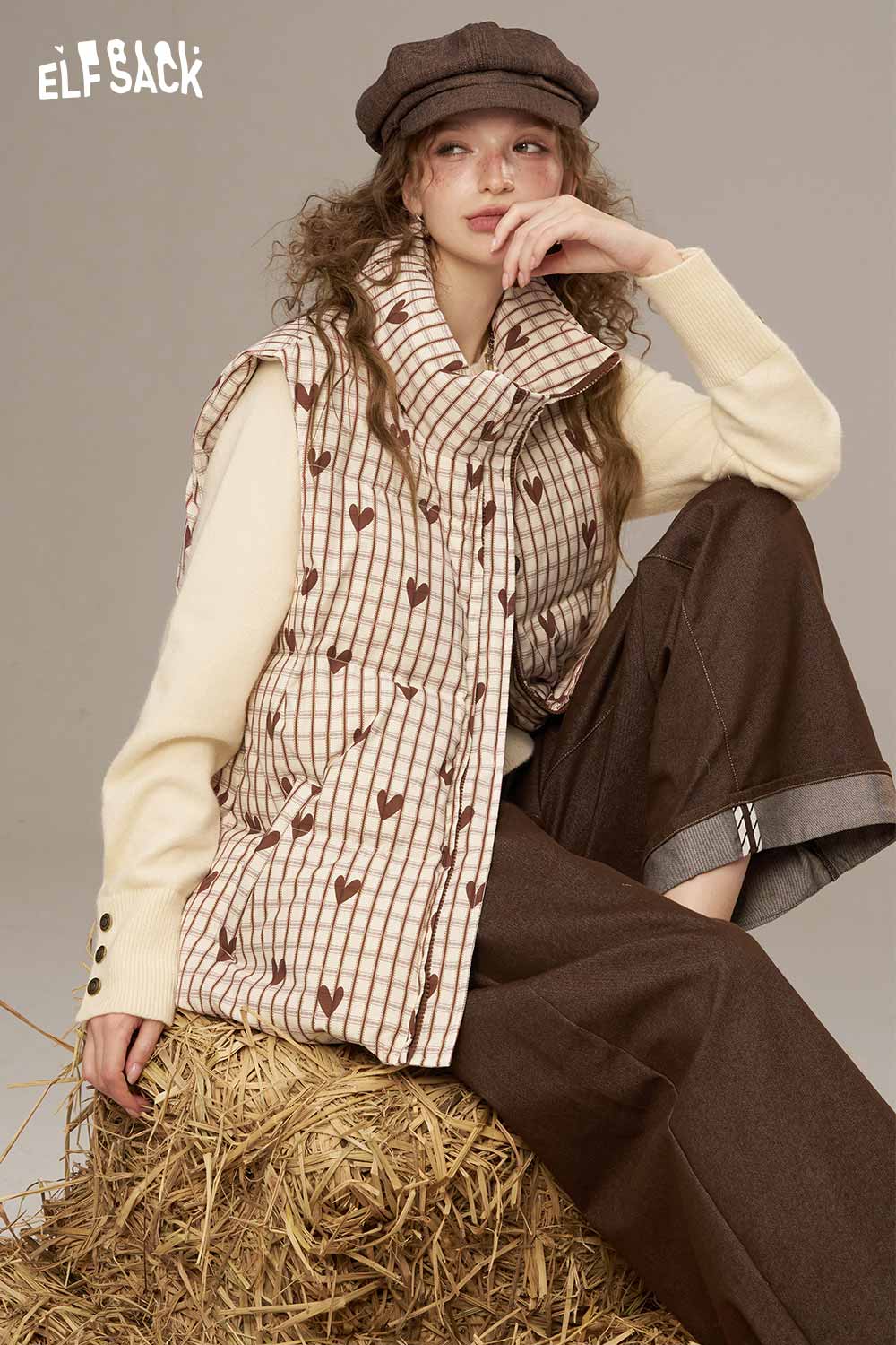 ELFSACK women's checkered down vest featuring stylish stripes and a cozy design for warmth