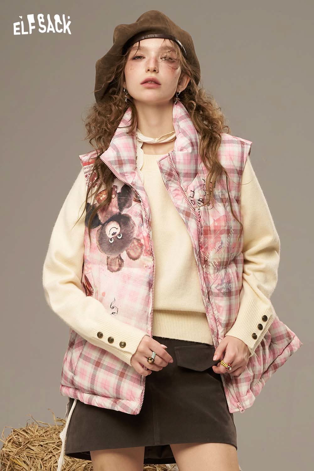 ELFSACK women's checkered down vest featuring a playful design and cozy fit for stylish layering