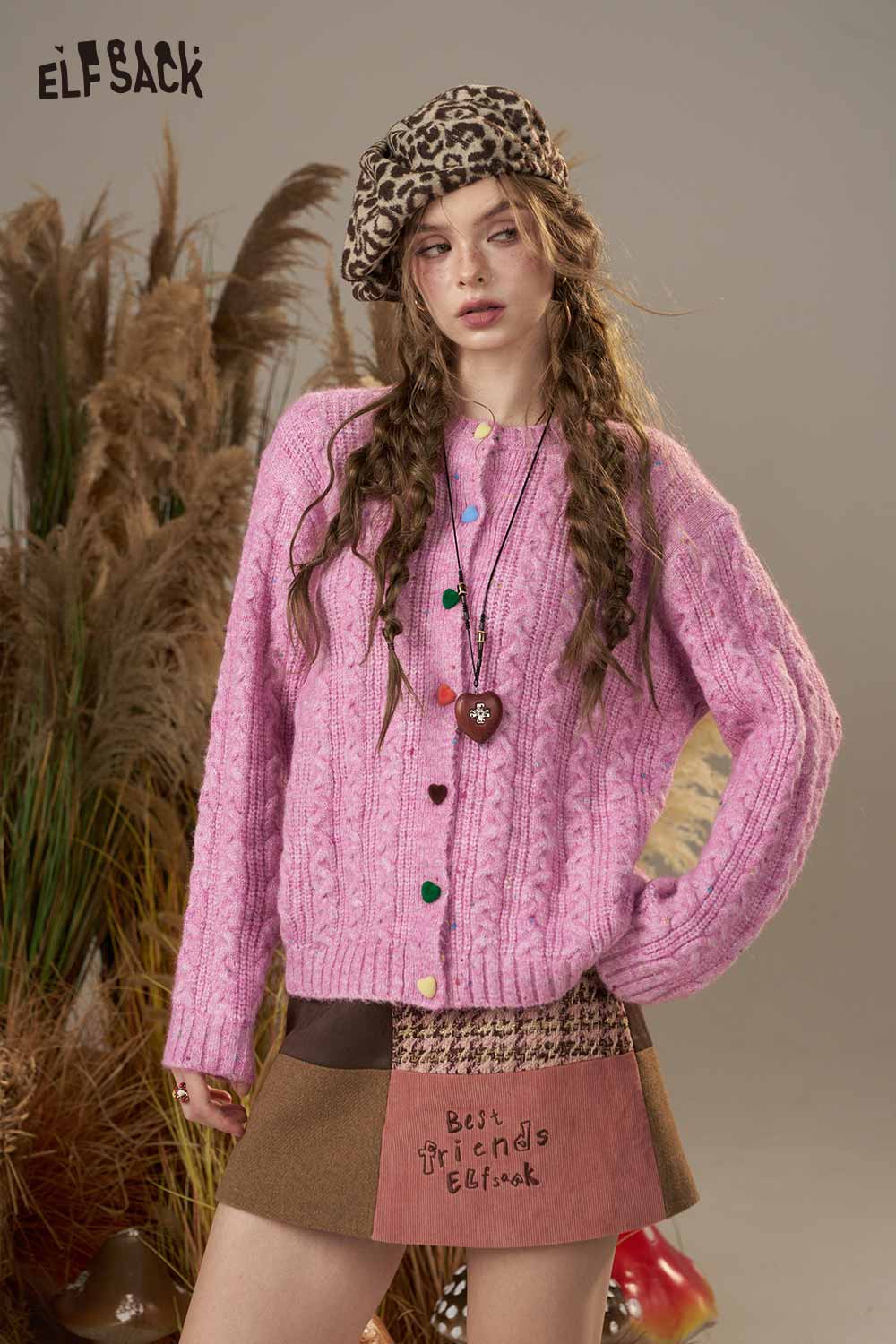 ELFSACK soft knit cardigan for women in vibrant pink with colorful buttons and a cozy design.