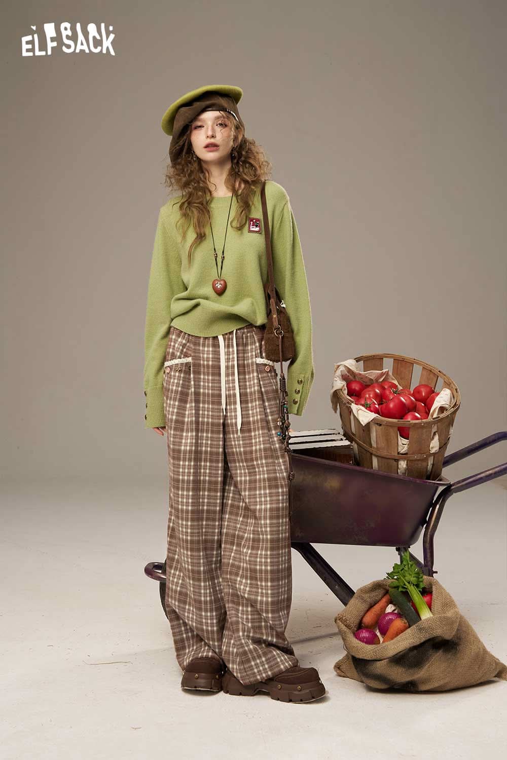 ELFSACK lace plaid straight leg pants styled with a green top and accessories, set against a neutral background