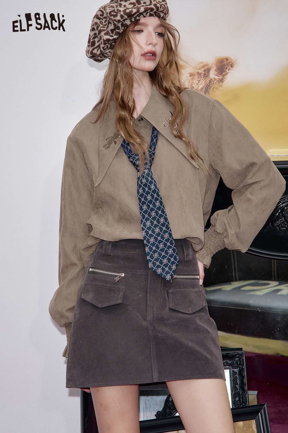 ELFSACK women's soft lapel collar shirt styled with a chic tie and paired with a brown skirt