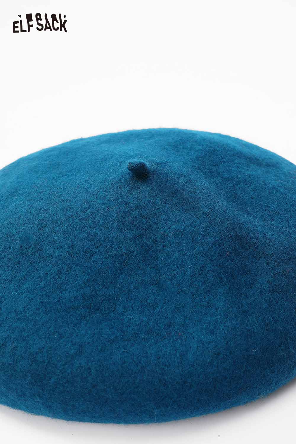 Soft pumpkin beanie for women in a vibrant teal color, perfect for casual outings