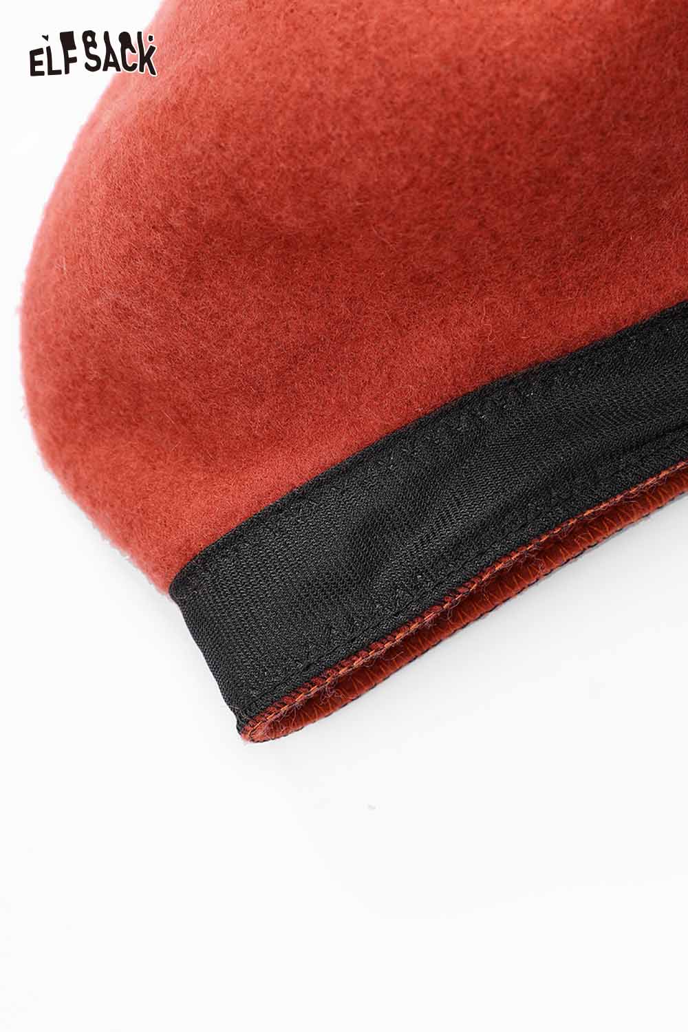 Soft pumpkin beanie for women featuring a cozy felt design and stylish black trim