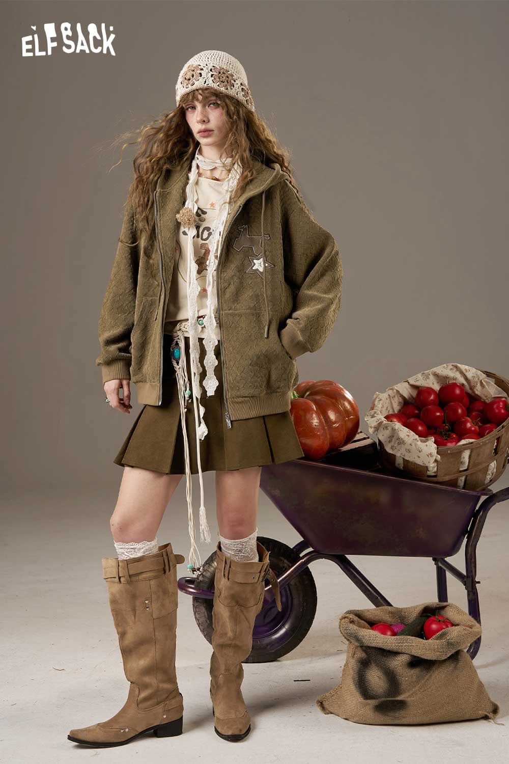 ELFSACK soft star hooded jacket for women styled with a skirt and knee-high boots in a casual autumn setting