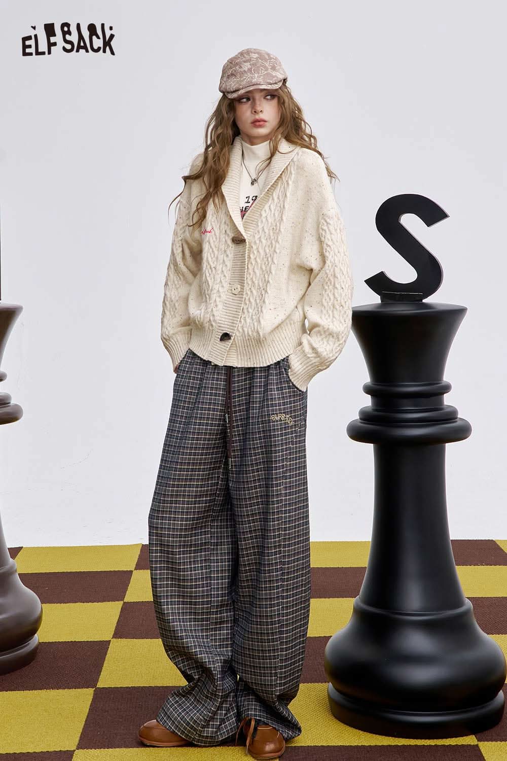 ELFSACK soft stripe embroidered wide leg pants styled with a cozy sweater and cap for a fashion-forward look