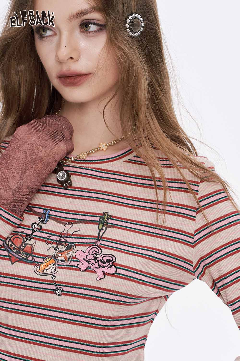 ELFSACK soft stripe graphic long sleeve tshirt featuring colorful prints on a striped background