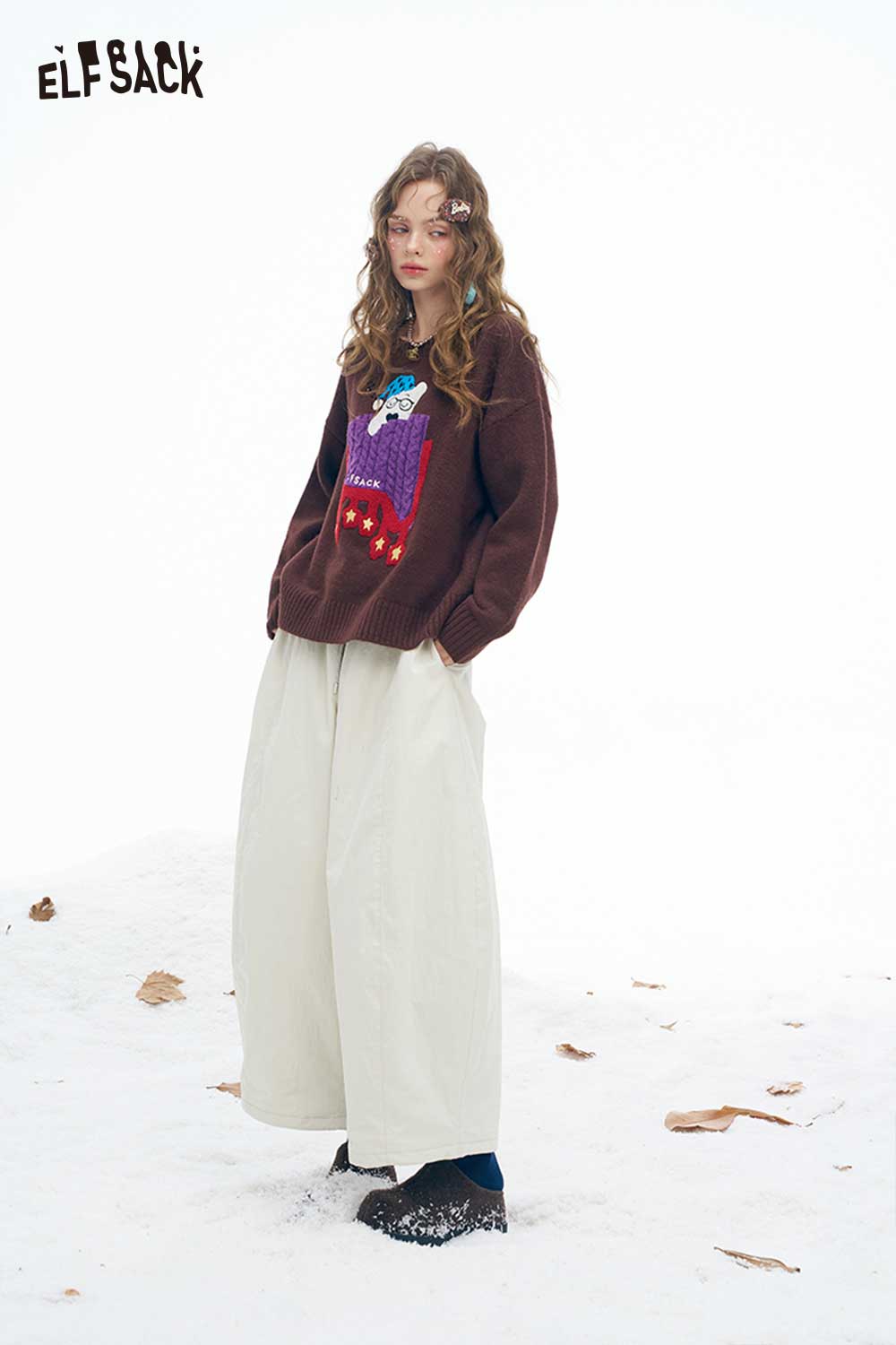 ELFSACK soft wide leg pants for women in cream, paired with a cozy sweater in a winter setting