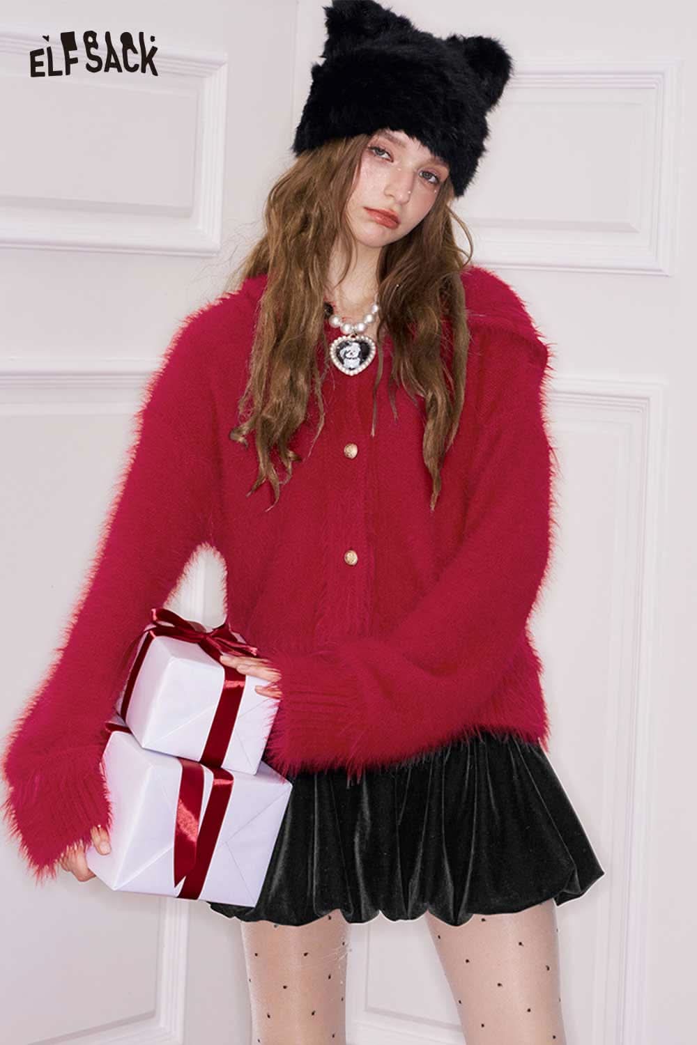 ELFSACK bunny ear hood cropped cardigan in pink with fluffy texture, styled with a skirt and festive gifts