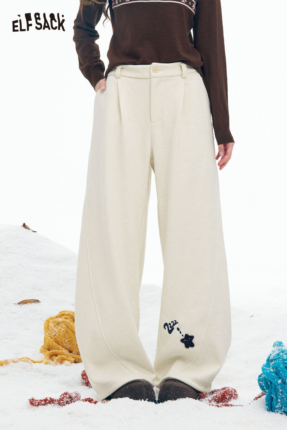 ELFSACK star graphic floor length pants in cream color with a relaxed fit for ultimate comfort