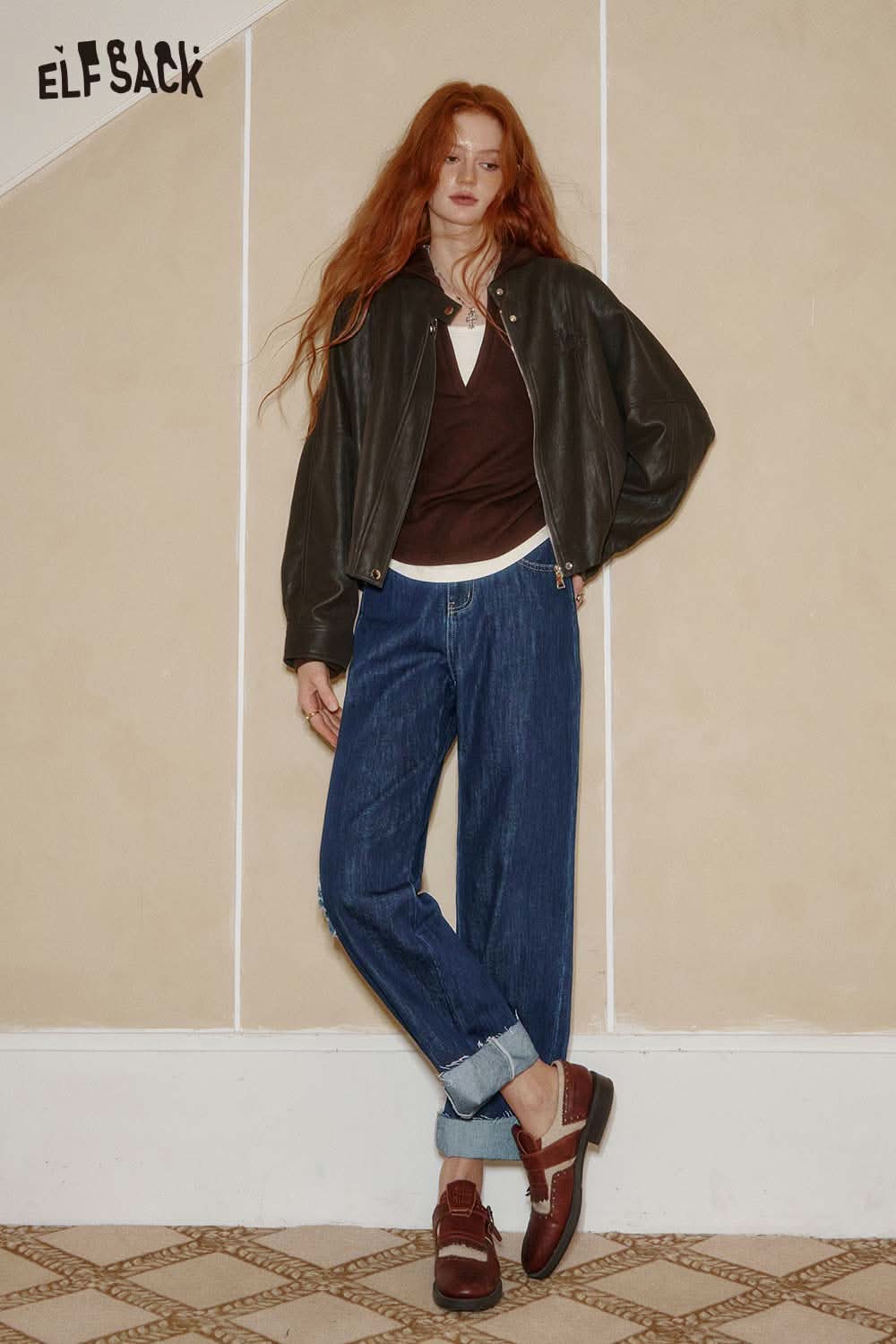 ELFSACK star stitch denim pants women styled with a leather jacket and casual shoes for a trendy look