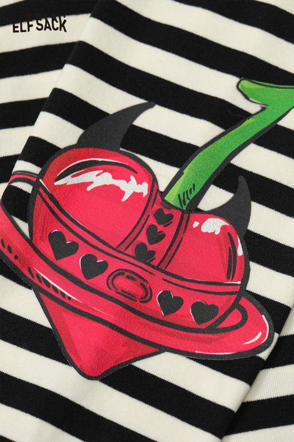 Striped high neck graphic t-shirt for women featuring a colorful heart design on a black and white striped background