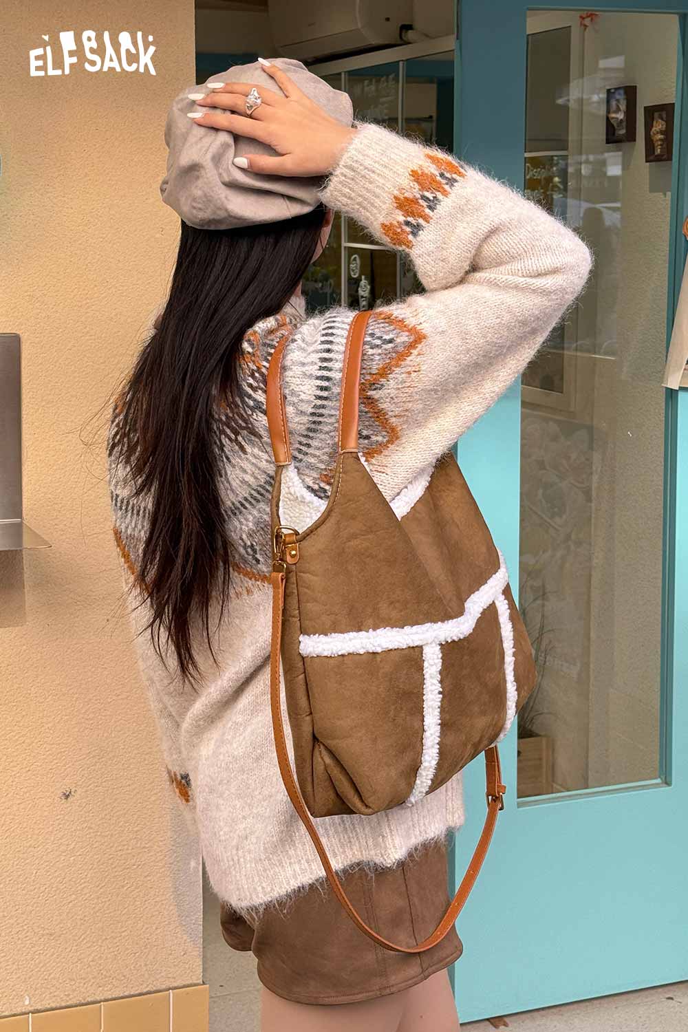 ELFSACK suede lambswool crossbody bag worn by a woman with a cozy sweater in a stylish setting