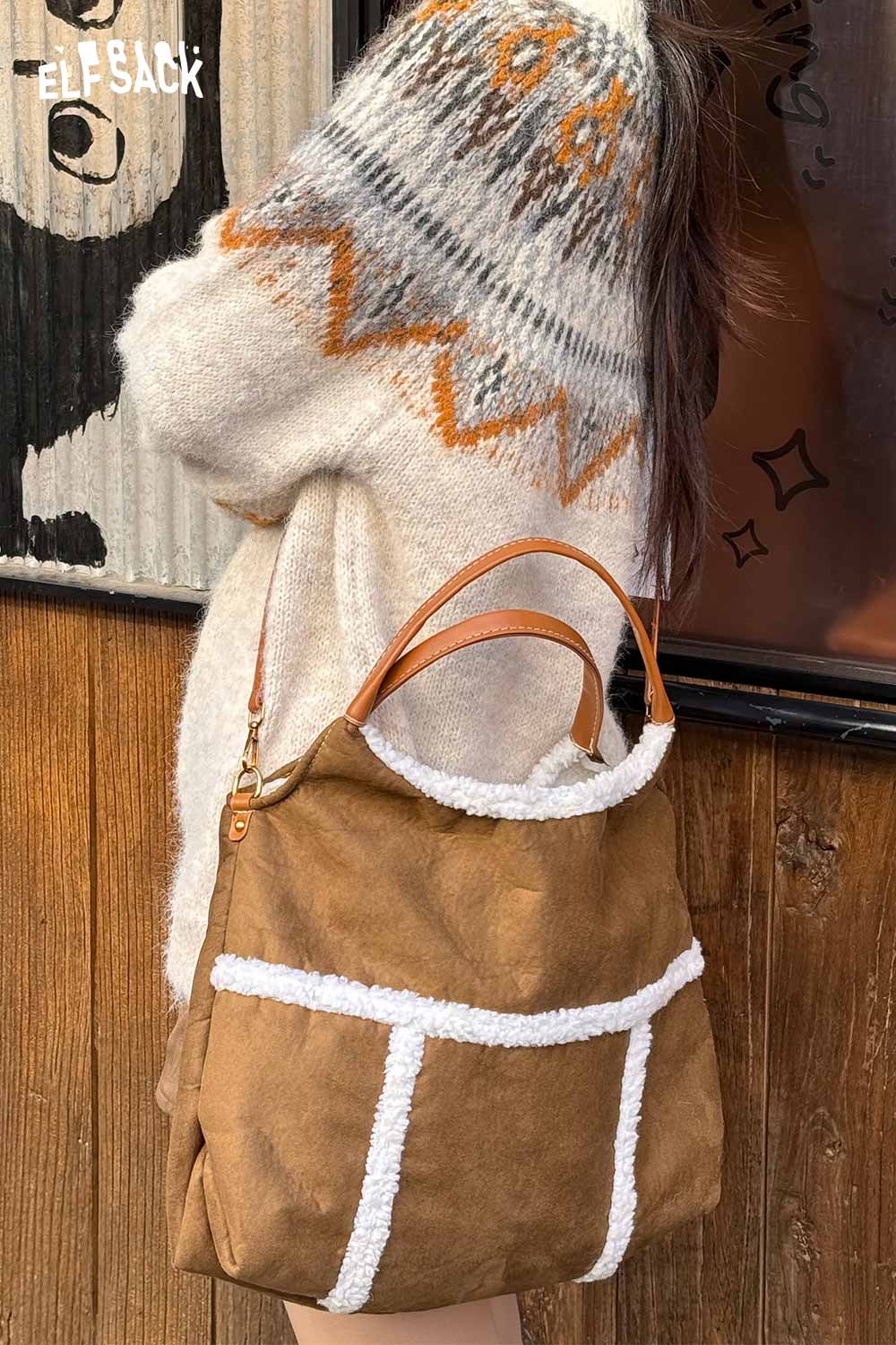 Stylish ELFSACK suede lambswool crossbody bag with a cozy sweater for a trendy look