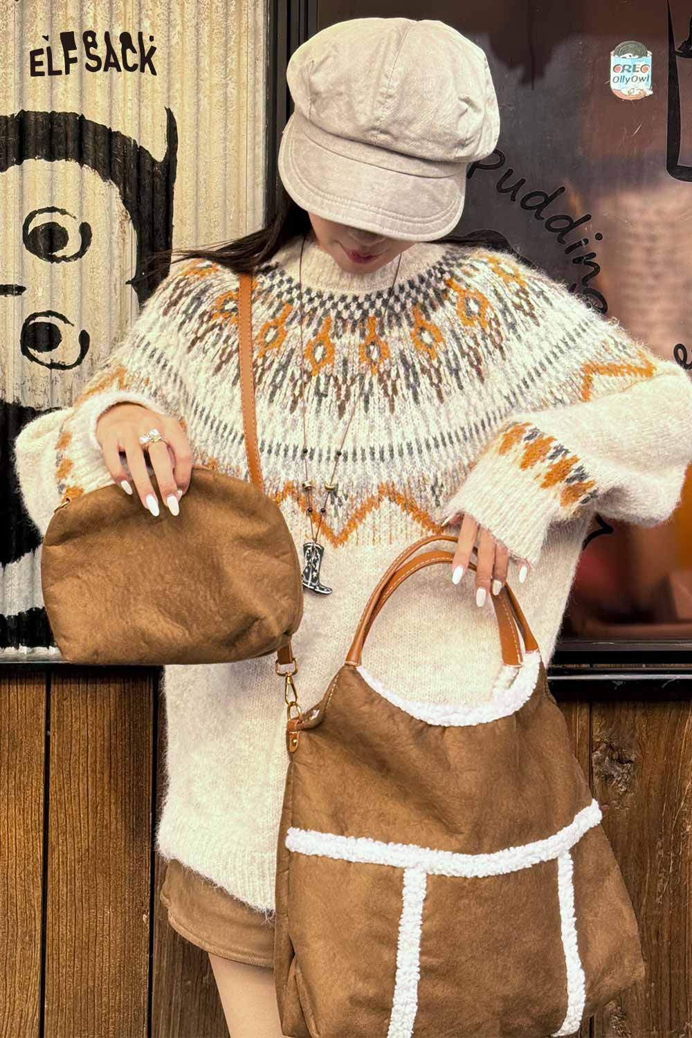 Model wearing a cozy sweater, holding a suede lambswool crossbody bag in brown with stylish design
