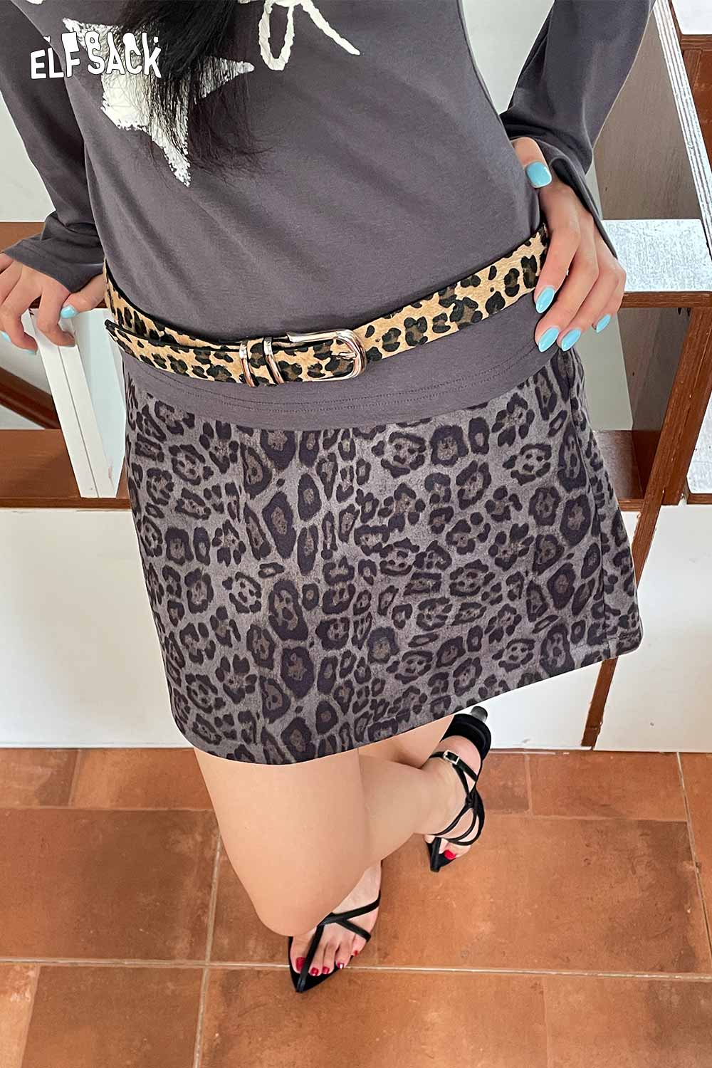 ELFSACK vegan suede animal print belt styled with a trendy outfit, featuring a leopard print design