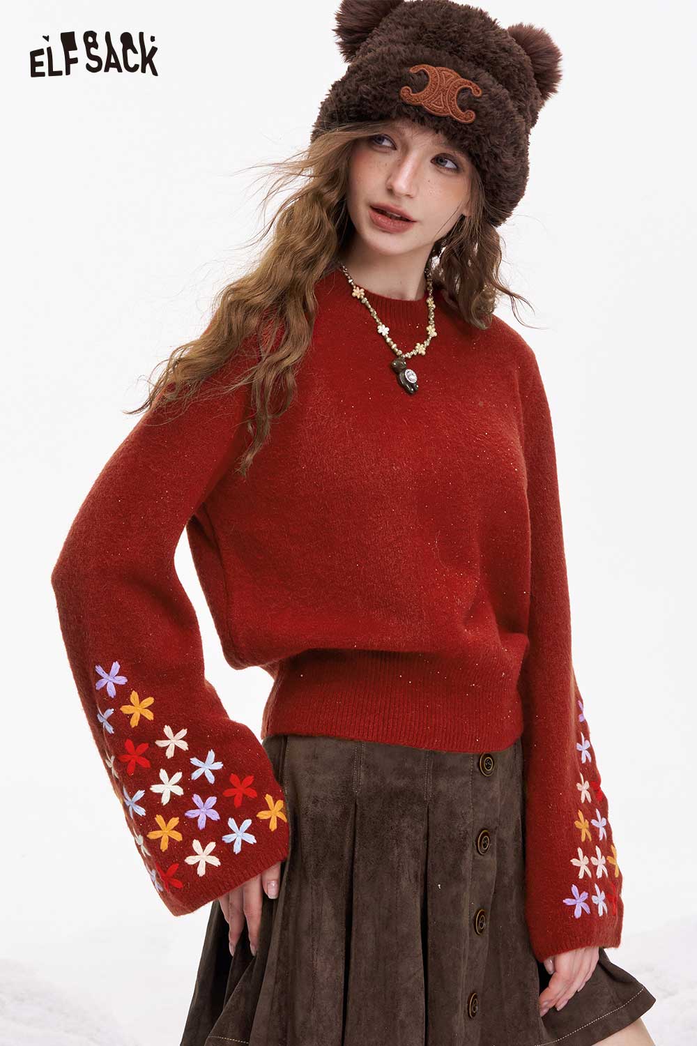Stylish ELFSACK cropped floral sleeve sweater with colorful flower designs on sleeves