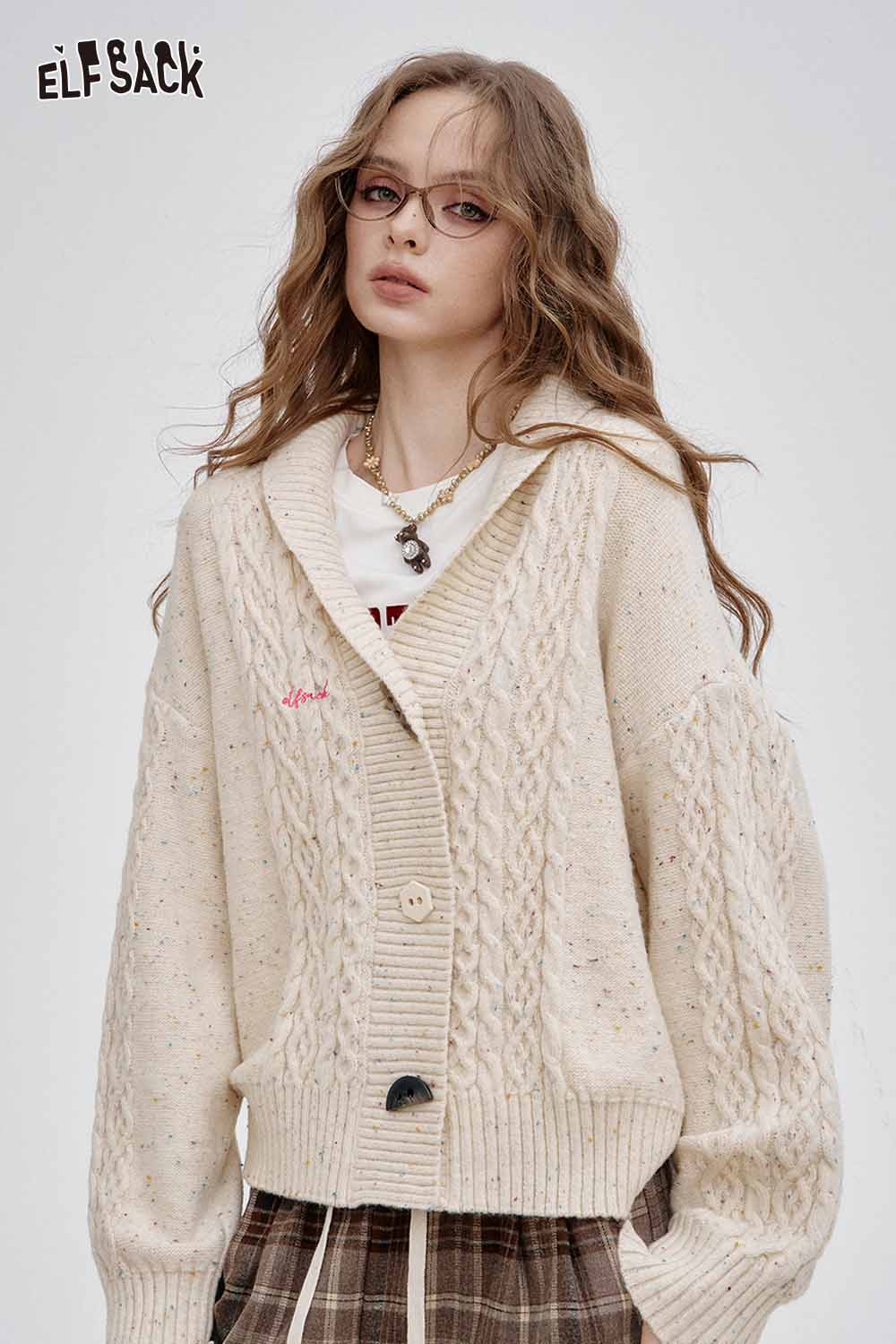 ELFSACK irregular button knit sweater in cream with a cozy oversized fit and cable knit design