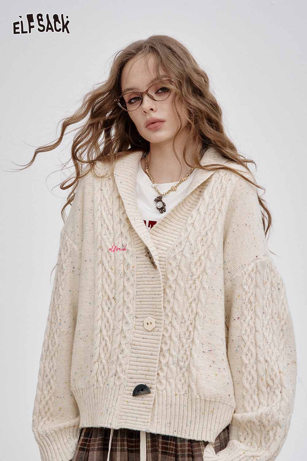 ELFSACK irregular button knit sweater in cream color with oversized fit and textured design