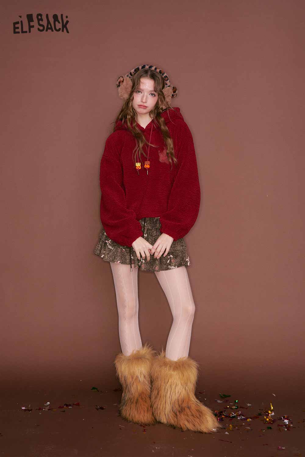 ELFSACK leopard print pleated skirt styled with a cozy red sweater and furry boots