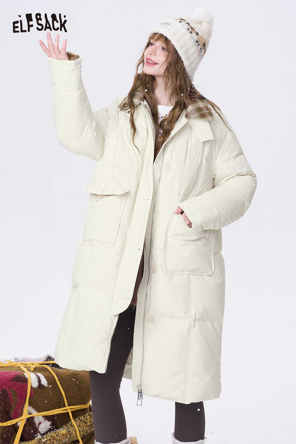 ELFSACK minimalist long down coat for women in cream color with practical pockets and stylish design
