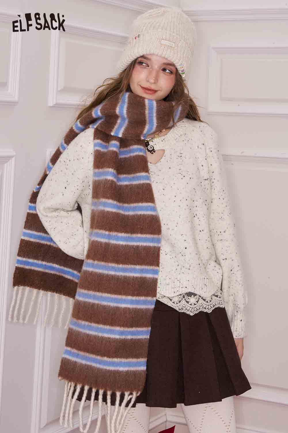 ELFSACK preppy striped fringe scarf in brown and blue, styled with a cozy sweater and skirt