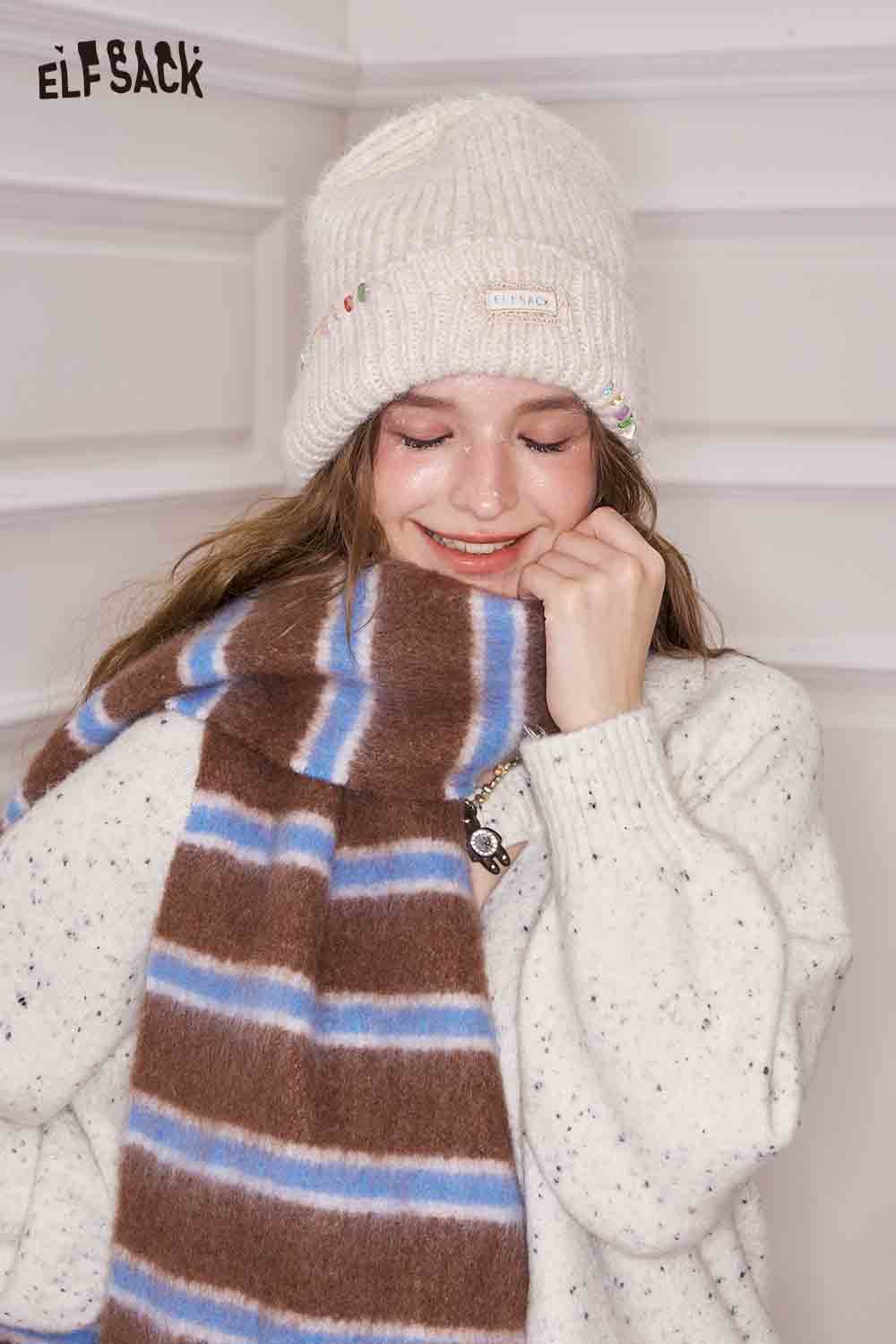 Cozy ELFSACK preppy striped fringe scarf paired with a knit hat for stylish winter warmth