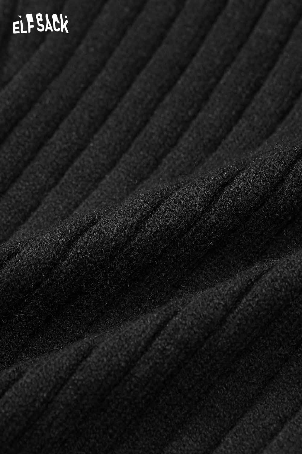 Close-up of ELFSACK slim fit heart logo knit sweater fabric showing a textured ribbed design