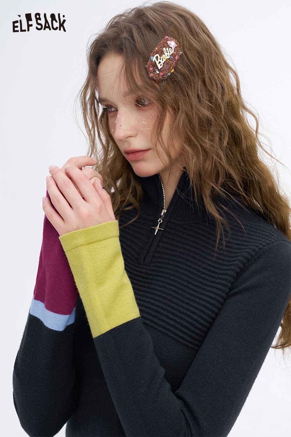 ELFSACK soft contrast sleeve knitwear featuring a zip-up design and vibrant color-blocked sleeves