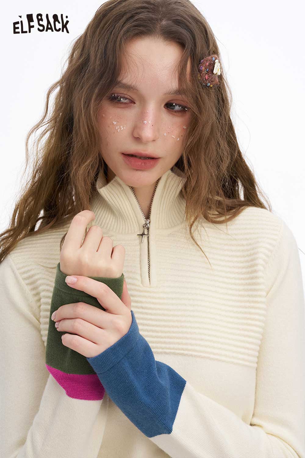 ELFSACK soft contrast sleeve knitwear with a half-zip design in cream and colorful sleeves