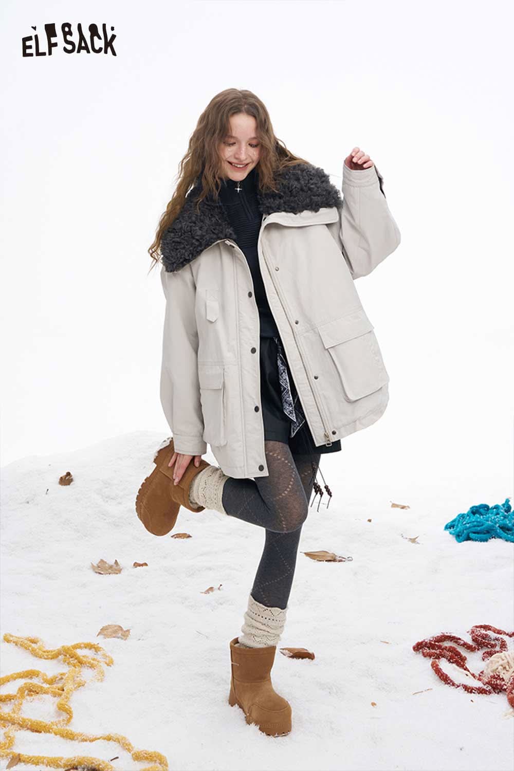 ELFSACK soft contrast sleeve knitwear featured in a winter fashion outfit with a cozy coat