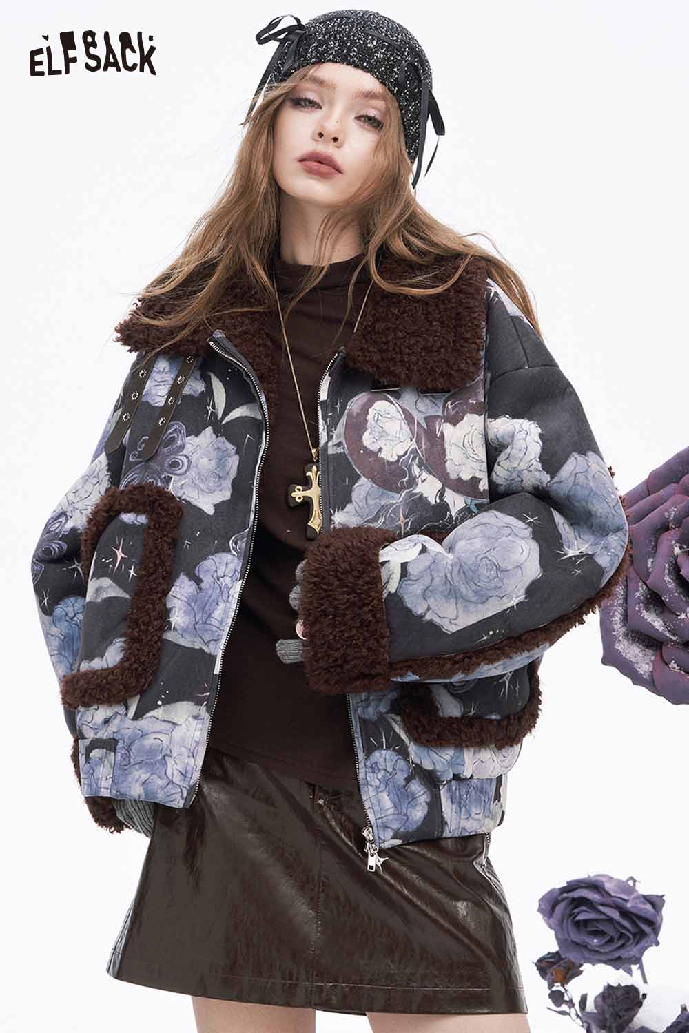 Model wearing an ELFSACK soft shiny leather skirt paired with a floral jacket for a trendy look