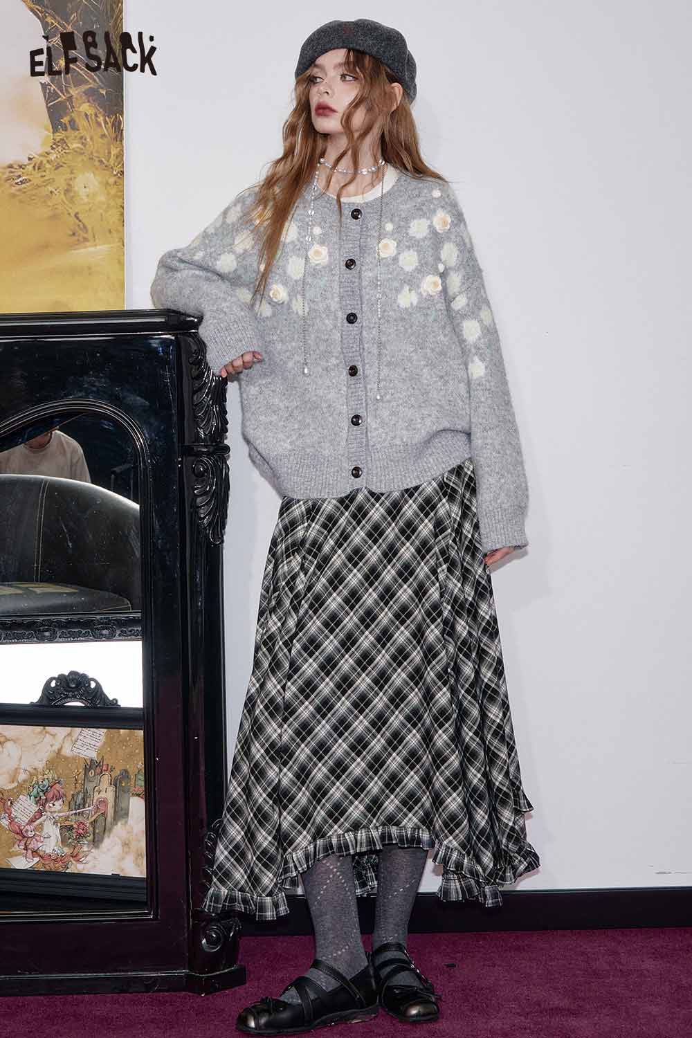 ELFSACK wool blend checkered skirt with a flowy design paired with a cozy grey sweater