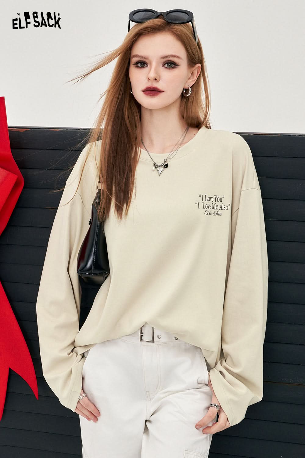 ELFSACK beige long sleeve T-shirt with Y2K Alphabet Graphic text print worn by model with white pants