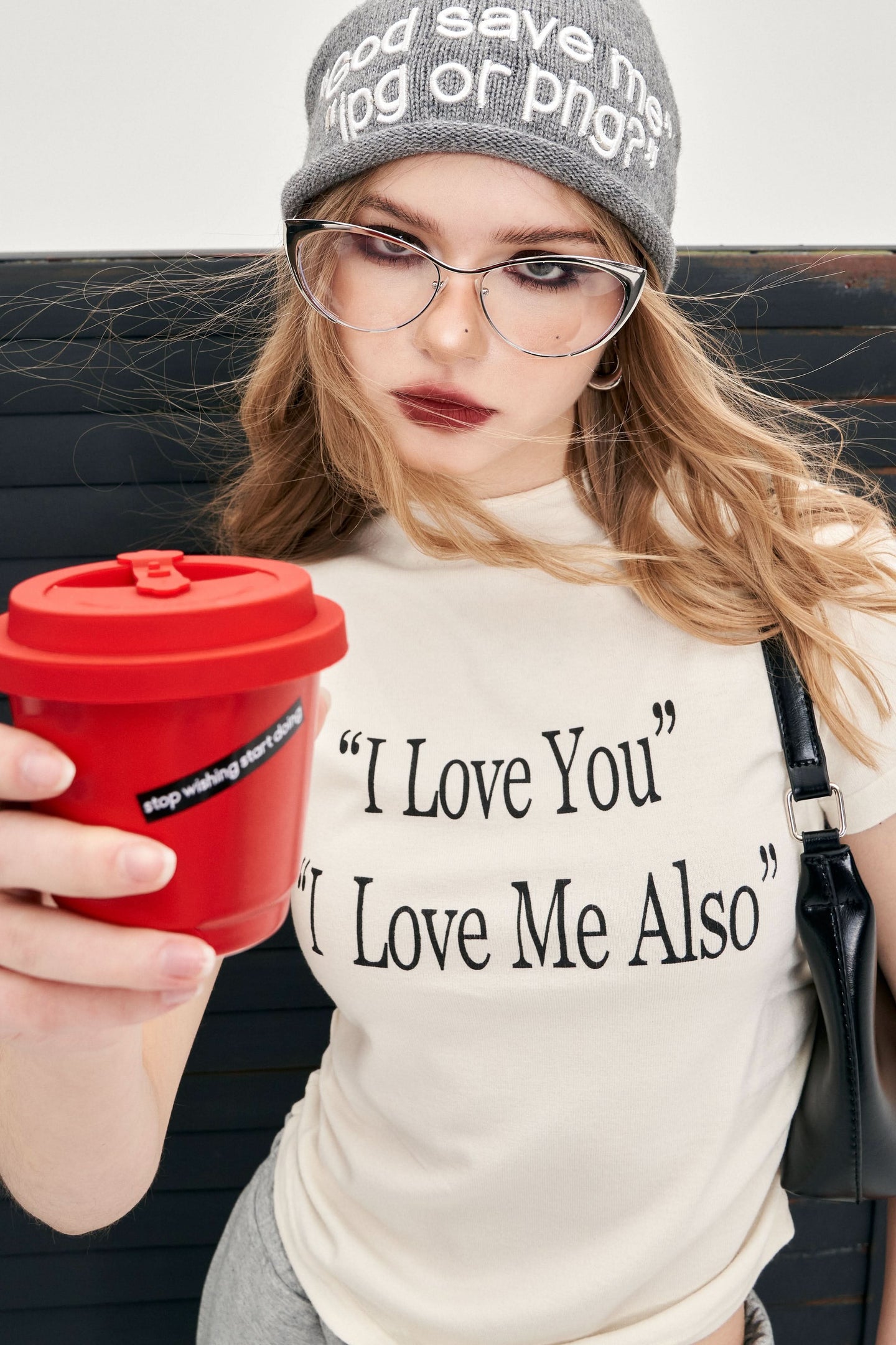 ELFSACK Y2K Alphabet Print Mock Neck T-shirt in white with I Love You text worn by woman holding red cup