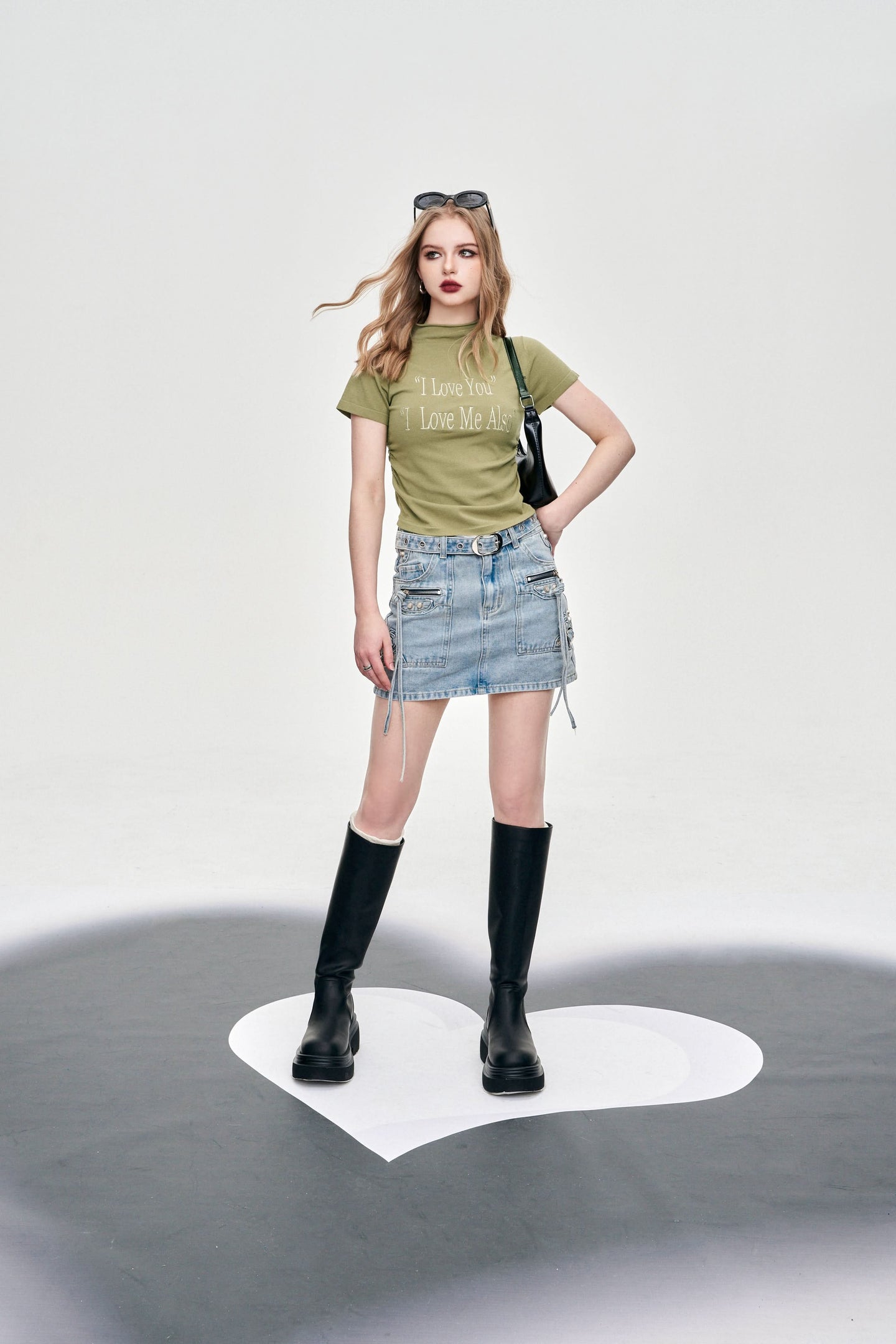 ELFSACK Y2K Alphabet Print Mock Neck T-shirt worn with denim mini skirt and black boots