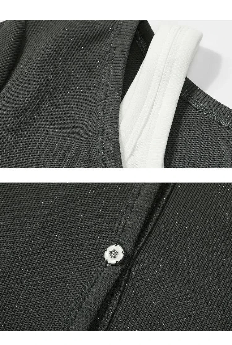 Close-up of ELFSACK Y2K Layered black ribbed T-shirt showing white inner layer and button detail