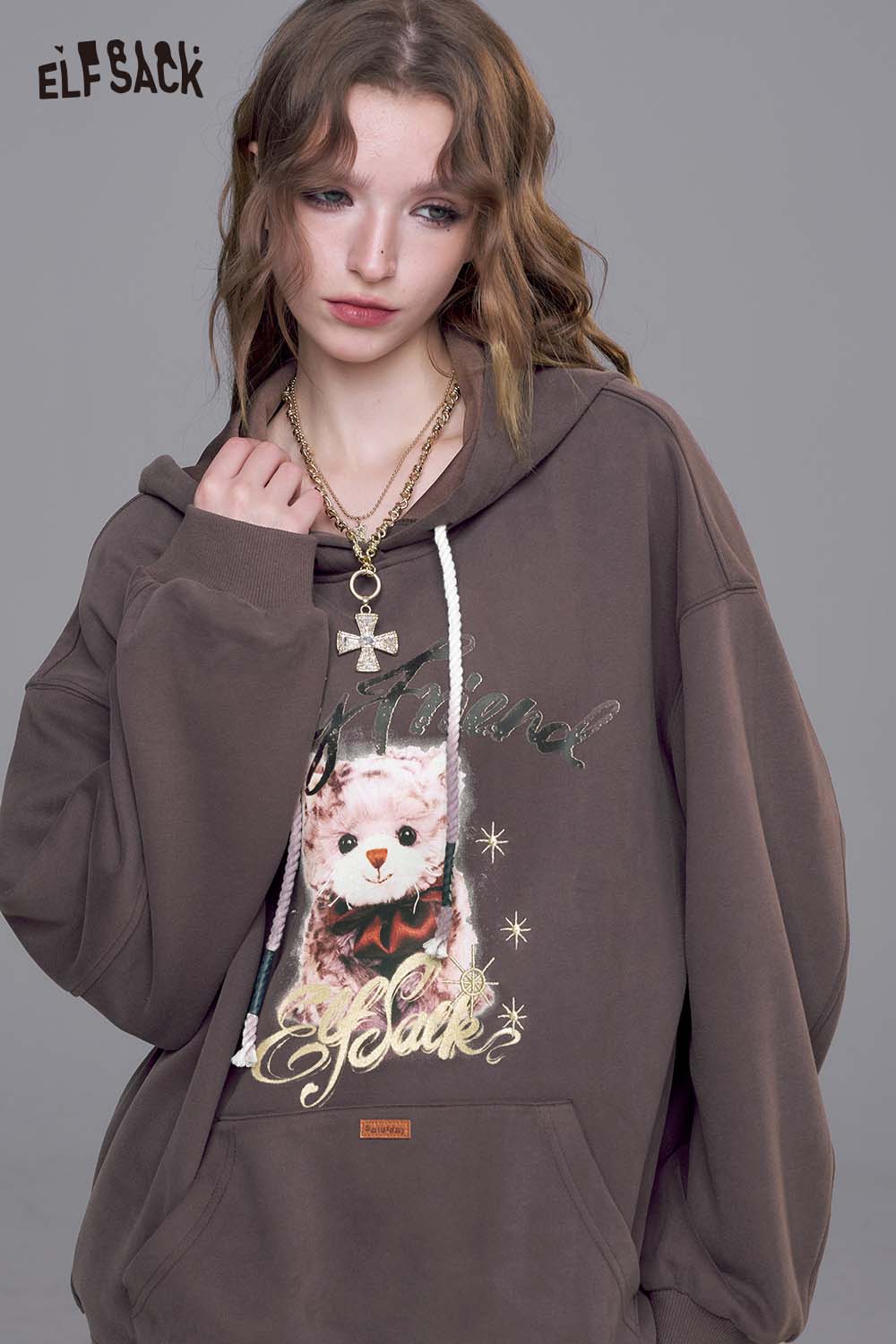 ELFSACK vintage cartoon graphic hoodie in brown with colorful printed design and drawstring hood