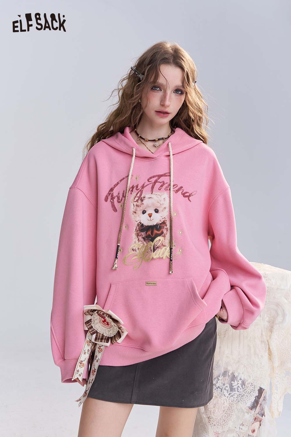 ELFSACK vintage cartoon graphic hoodie in pink featuring a cute bear design and spacious front pocket