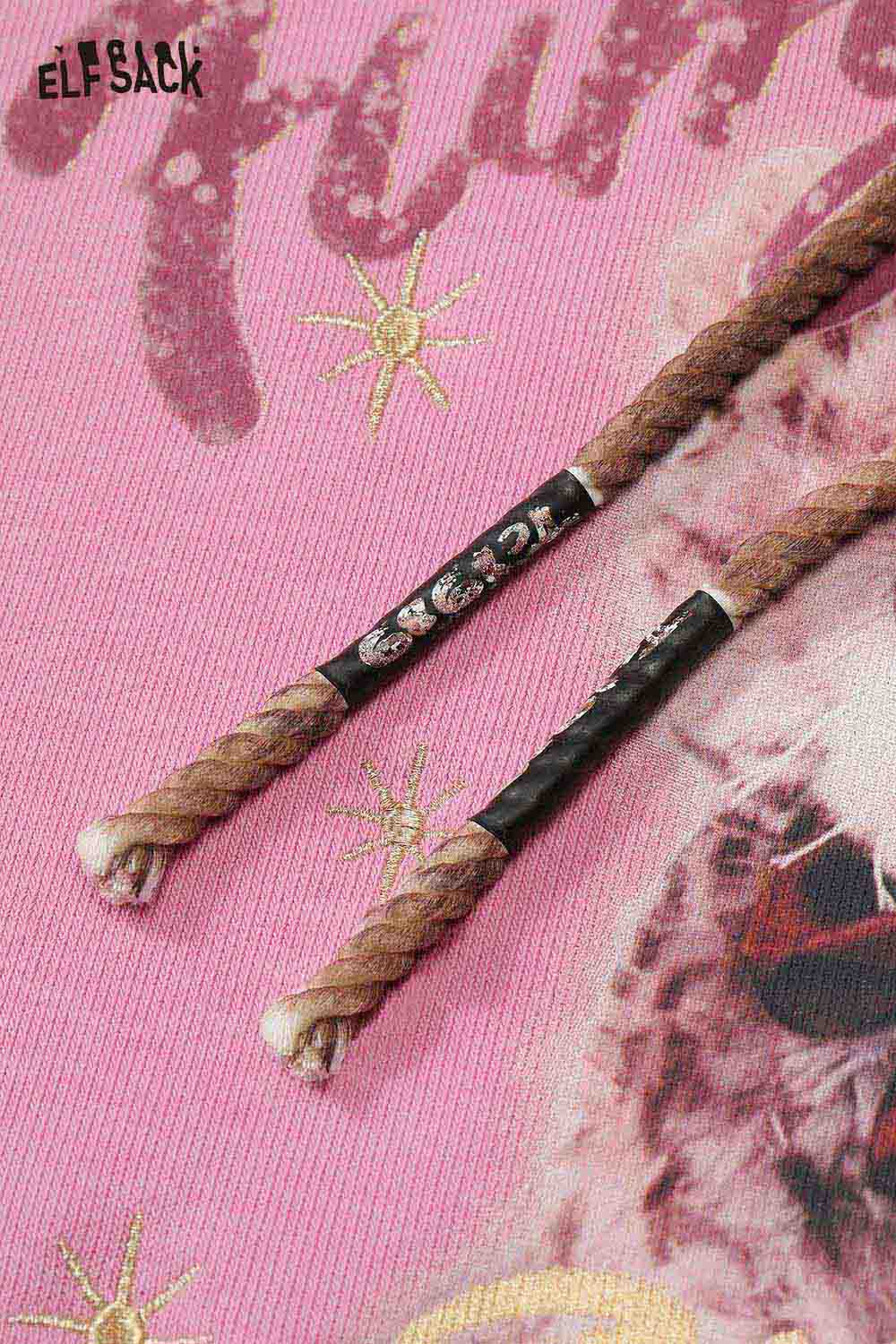 Close-up of ELFSACK vintage cartoon graphic hoodie featuring unique drawstrings and vibrant print