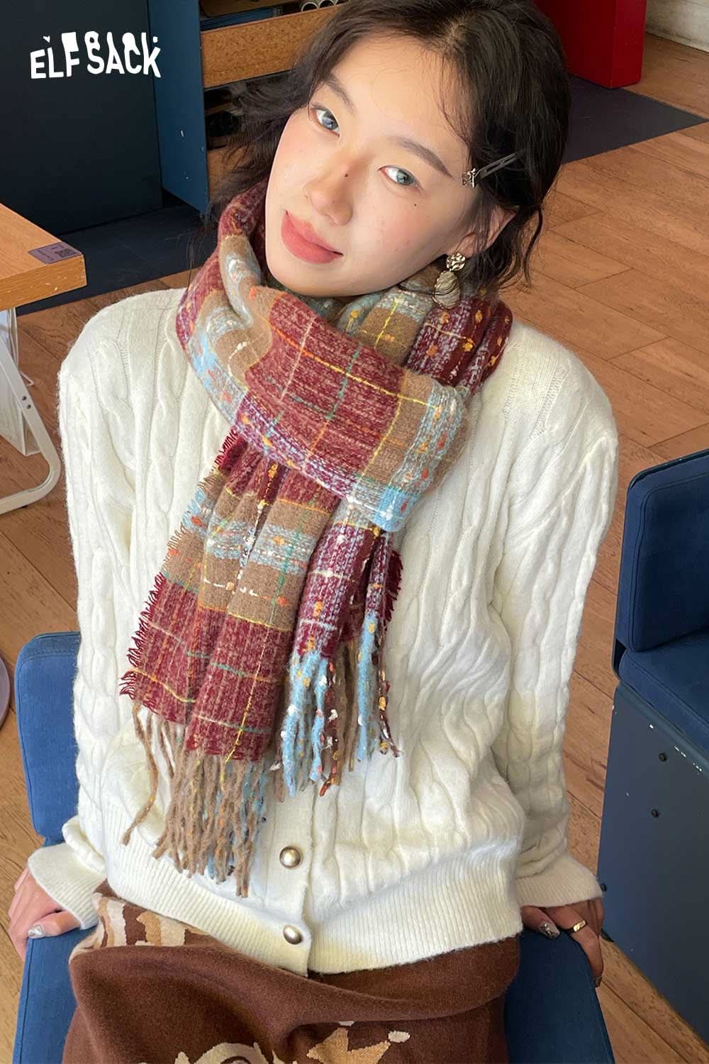 Stylish woman wearing a vintage plaid wool scarf over a cozy sweater for a trendy look