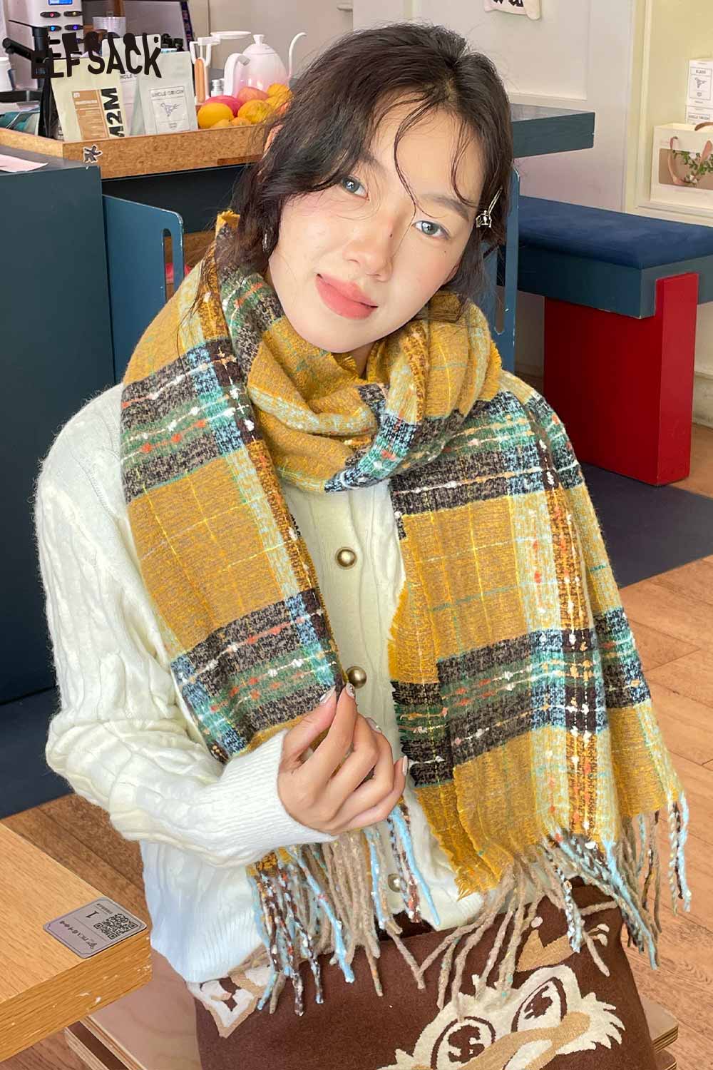 Woman wearing a cozy sweater with a vintage plaid wool scarf in warm colors, perfect for fall fashion.